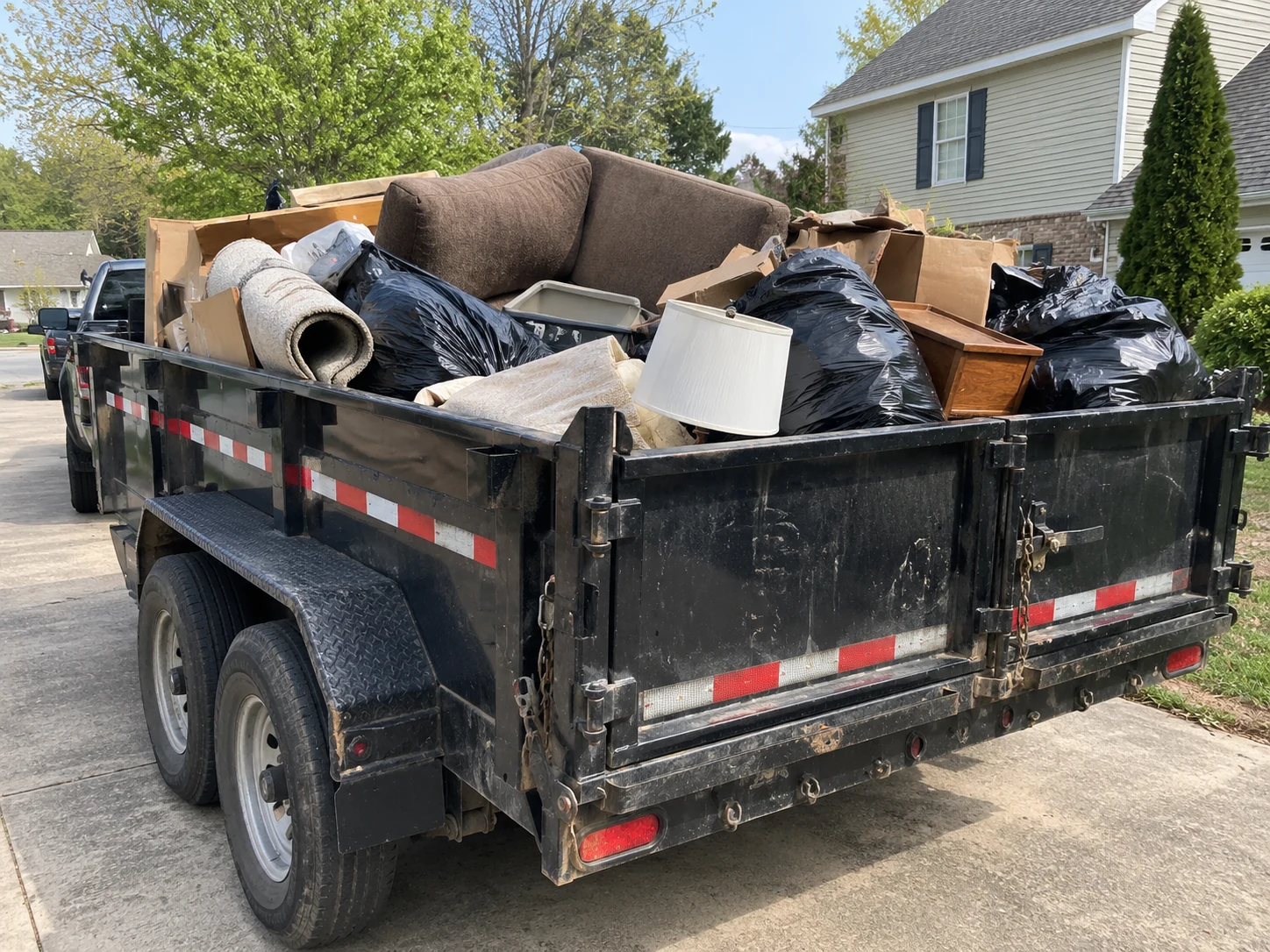 Example junk removal showing a loaded dump trailer
